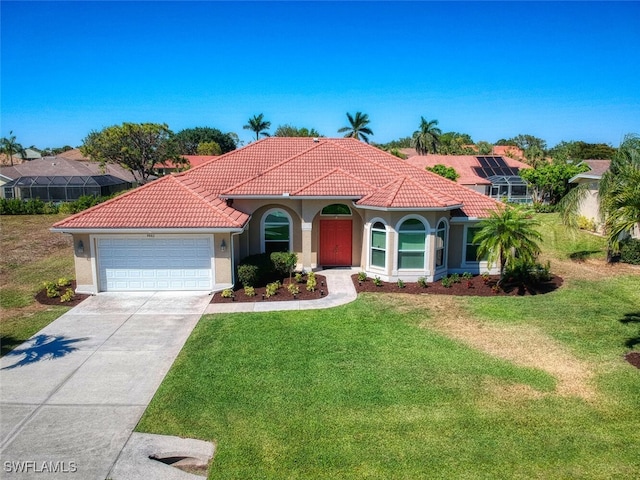 mediterranean / spanish-style home featuring a front yard and a garage