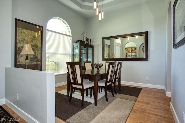 dining area with a chandelier and hardwood / wood-style flooring