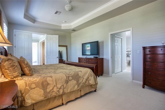 carpeted bedroom with crown molding, a raised ceiling, and ceiling fan