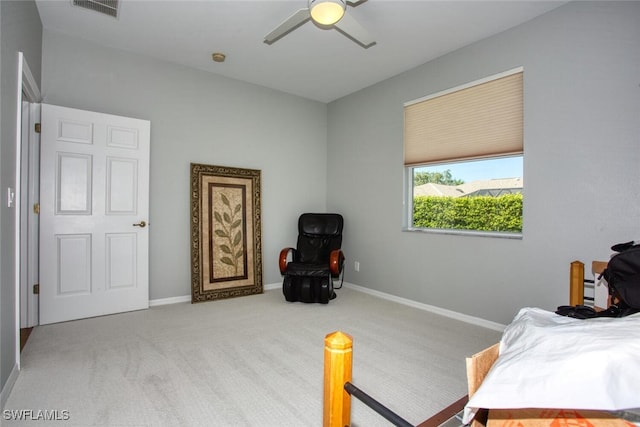 bedroom with ceiling fan and light carpet