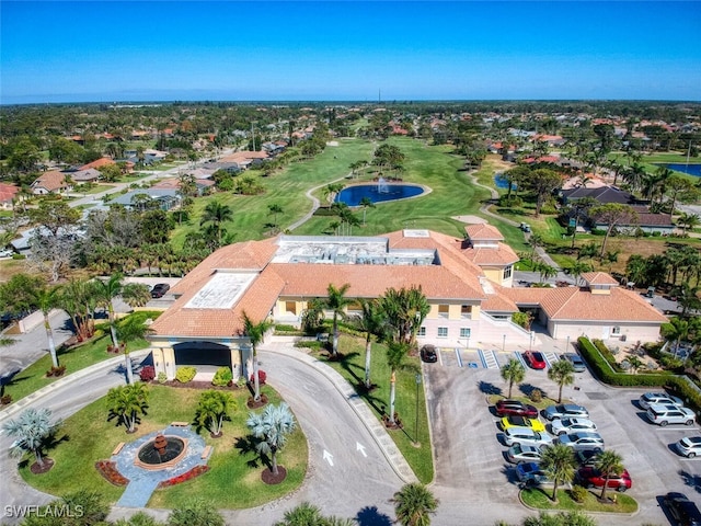 birds eye view of property featuring golf course view, a residential view, and a water view