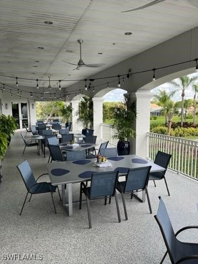 view of patio with outdoor dining area and ceiling fan