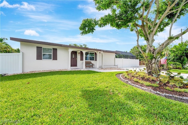 ranch-style home with a front yard