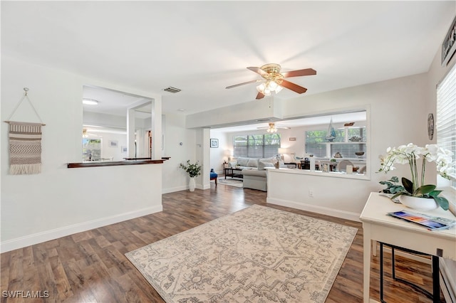 living room with hardwood / wood-style floors and ceiling fan