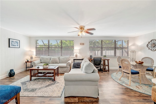 living room featuring ceiling fan and light hardwood / wood-style floors