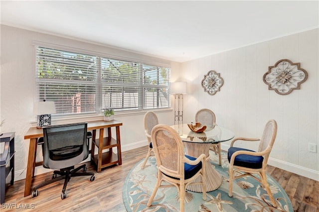 dining space featuring plenty of natural light and light hardwood / wood-style floors