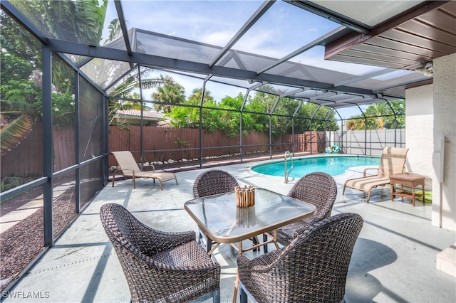 view of pool with a lanai and a patio