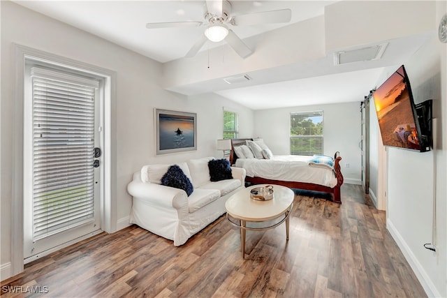 bedroom featuring wood-type flooring, ceiling fan, and access to outside