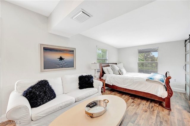 bedroom with wood-type flooring