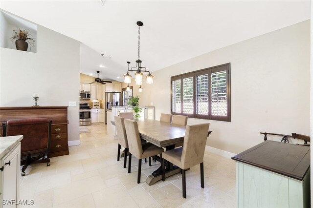 dining space with lofted ceiling and ceiling fan