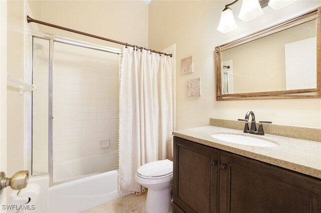 full bathroom featuring tile patterned floors, toilet, shower / tub combo with curtain, and vanity