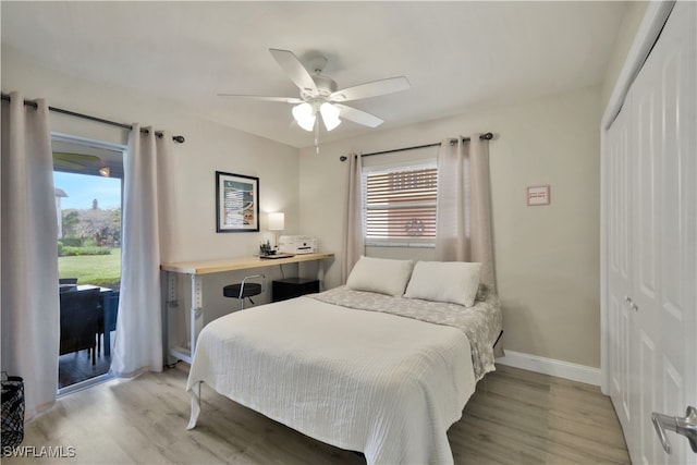 bedroom with light hardwood / wood-style floors, access to outside, a closet, and ceiling fan