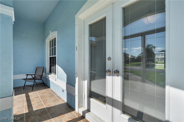 view of exterior entry featuring french doors