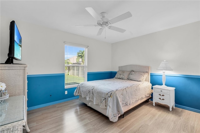 bedroom with ceiling fan and light hardwood / wood-style floors