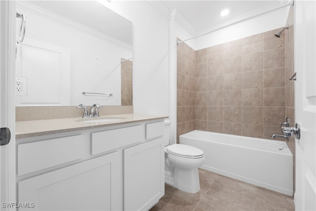 full bathroom featuring toilet, tile patterned flooring, tiled shower / bath, crown molding, and vanity