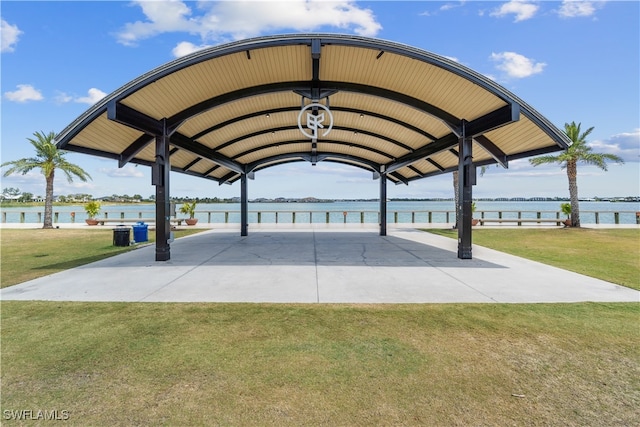 view of property's community featuring a yard and a water view