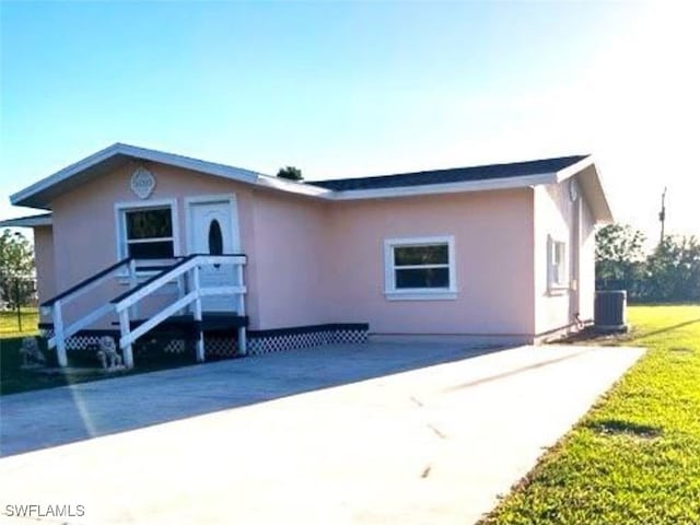 view of front of house featuring central air condition unit