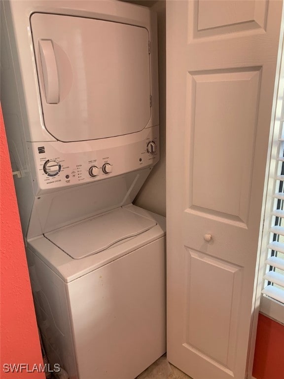 laundry area featuring stacked washer and clothes dryer