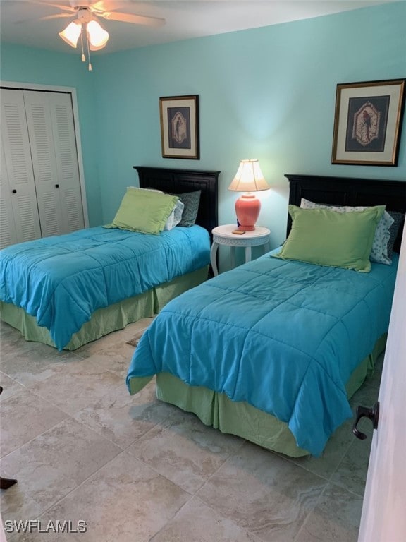 bedroom featuring ceiling fan and a closet