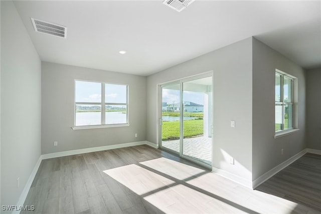 spare room featuring hardwood / wood-style floors