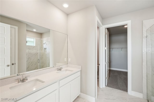 bathroom with walk in shower and vanity