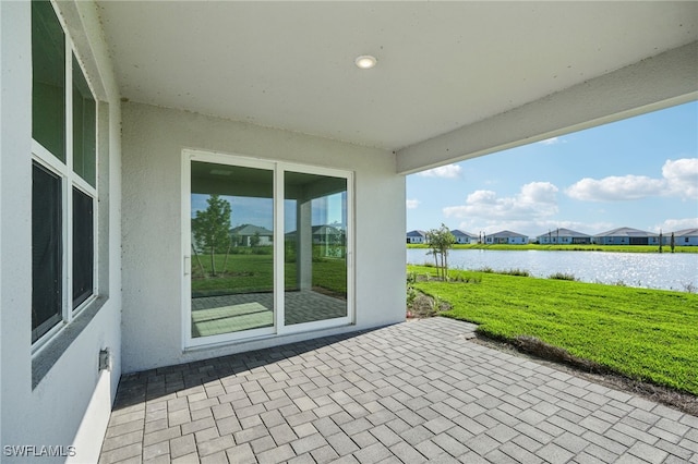 view of patio featuring a water view