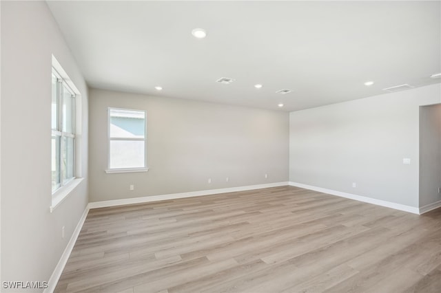 unfurnished room featuring light hardwood / wood-style flooring