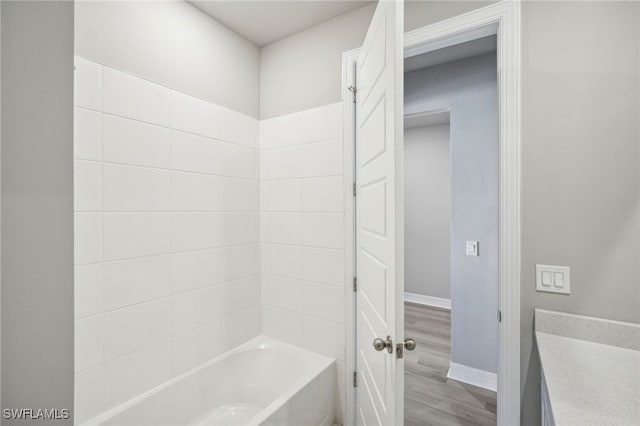 bathroom featuring tub / shower combination and hardwood / wood-style floors