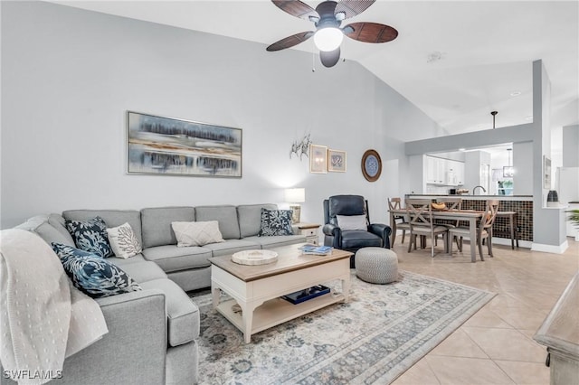 living room with ceiling fan, light tile patterned flooring, and high vaulted ceiling