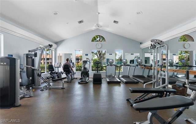 gym with ceiling fan, plenty of natural light, and lofted ceiling