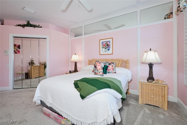 bedroom featuring ceiling fan, a closet, and carpet floors