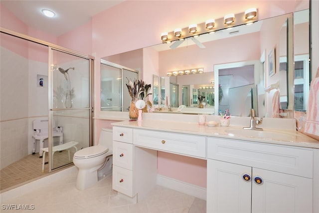 bathroom featuring tile patterned floors, toilet, walk in shower, and vanity