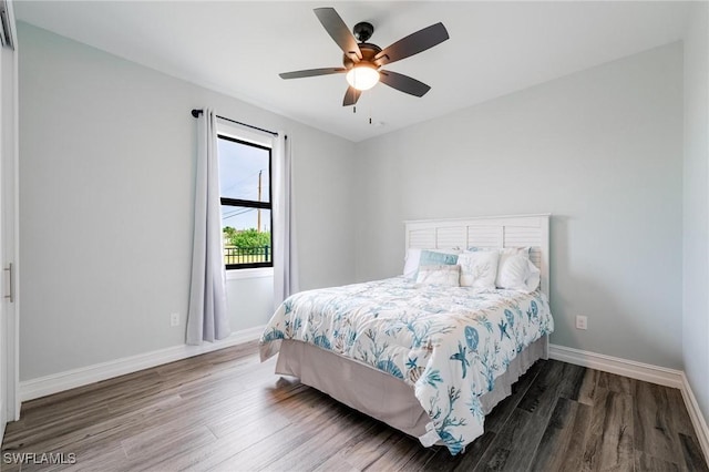 bedroom featuring ceiling fan and dark hardwood / wood-style flooring