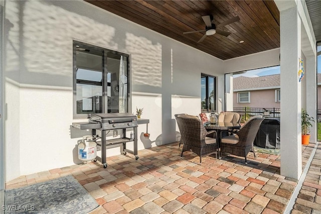 view of patio featuring grilling area and ceiling fan