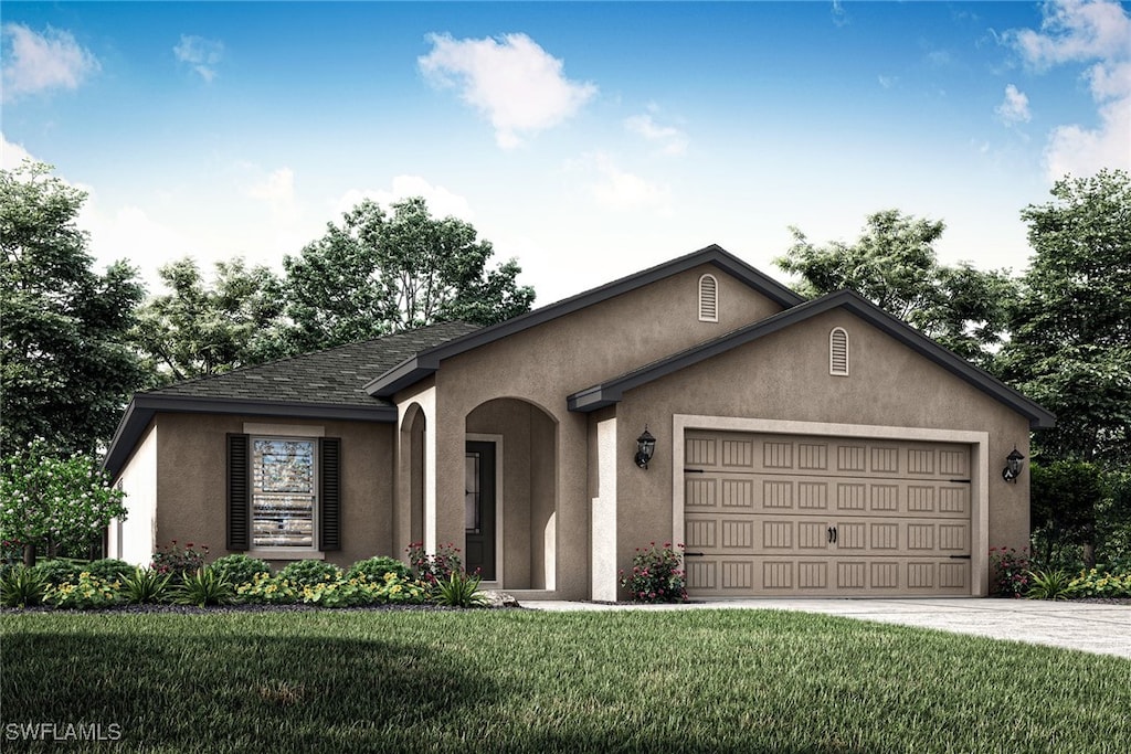 view of front of property with a garage and a front yard