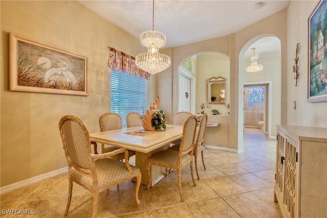 dining space featuring an inviting chandelier and light tile patterned flooring