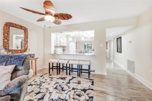 living room with ceiling fan