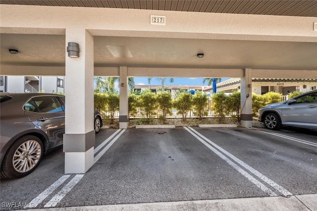 view of vehicle parking featuring a carport