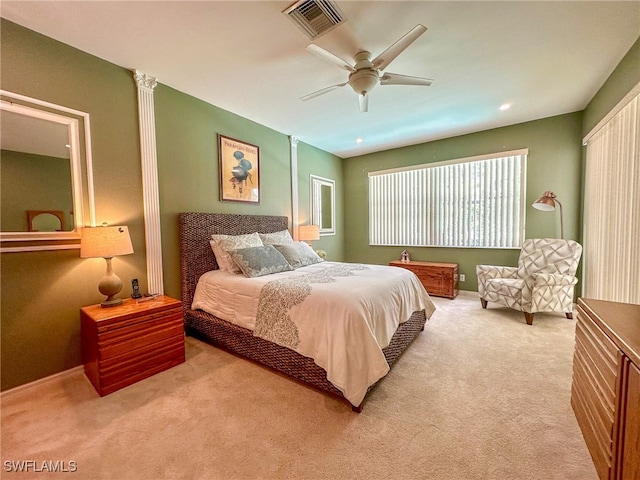 bedroom featuring light colored carpet and ceiling fan