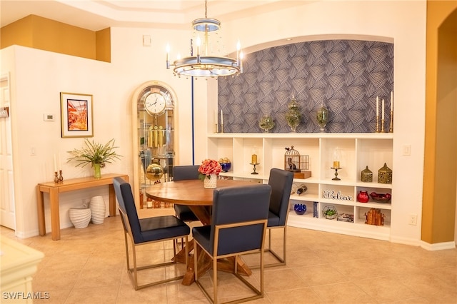 tiled dining space with a notable chandelier