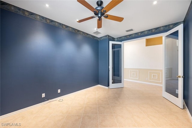 unfurnished room featuring french doors, a ceiling fan, visible vents, and tile patterned floors