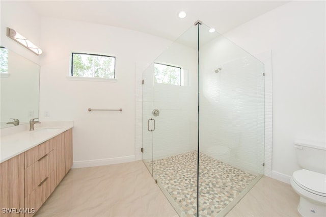 bathroom featuring a shower with door, toilet, tile patterned flooring, and vanity