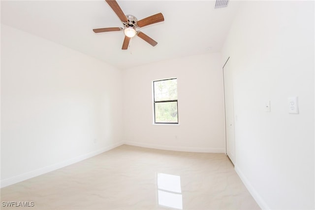 unfurnished room with ceiling fan and light carpet