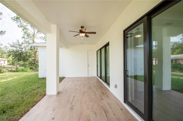 view of patio / terrace featuring ceiling fan