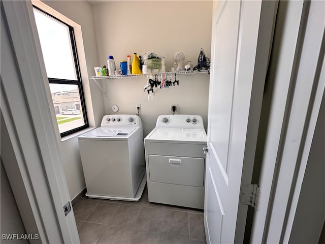 laundry area with tile patterned flooring and washing machine and dryer