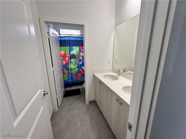 bathroom featuring vanity, toilet, and tile patterned floors