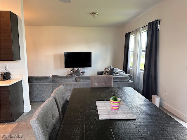 dining space with light tile patterned floors