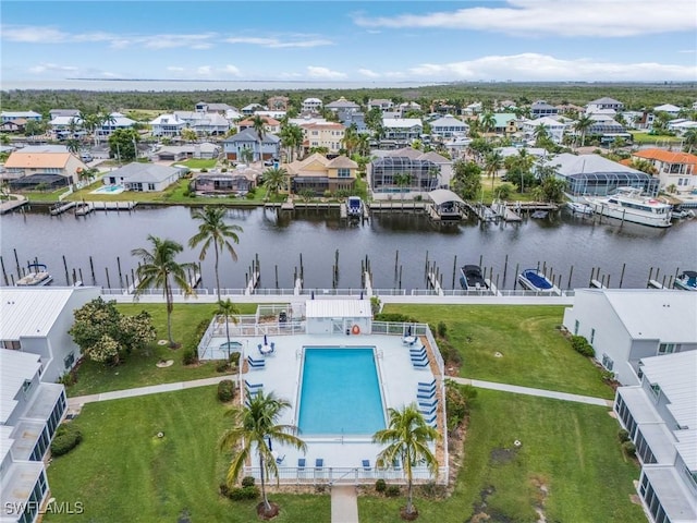 birds eye view of property with a residential view and a water view