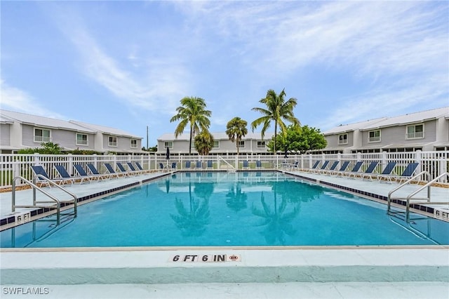 community pool featuring fence