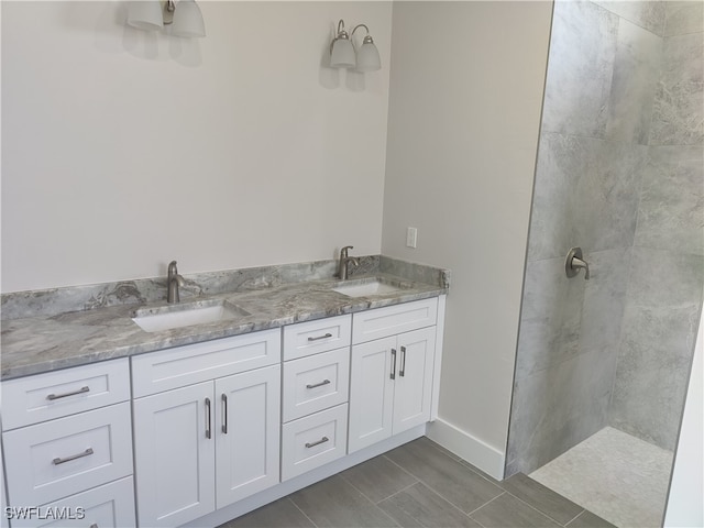 bathroom featuring vanity and a tile shower